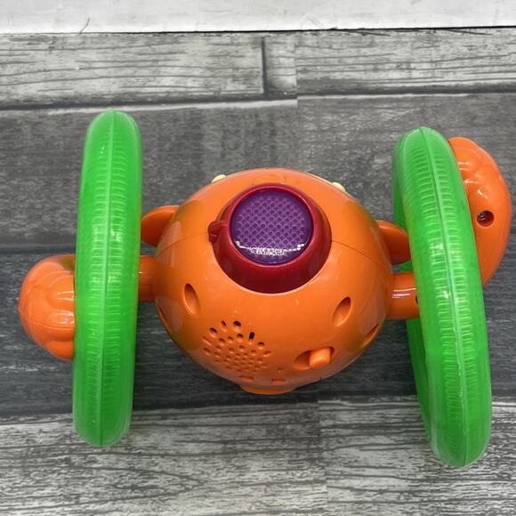 Bright Starts Roll & Glow Monkey Toy with Lights and Melodies, Ages 6M+ {1} - Picture 5 of 9